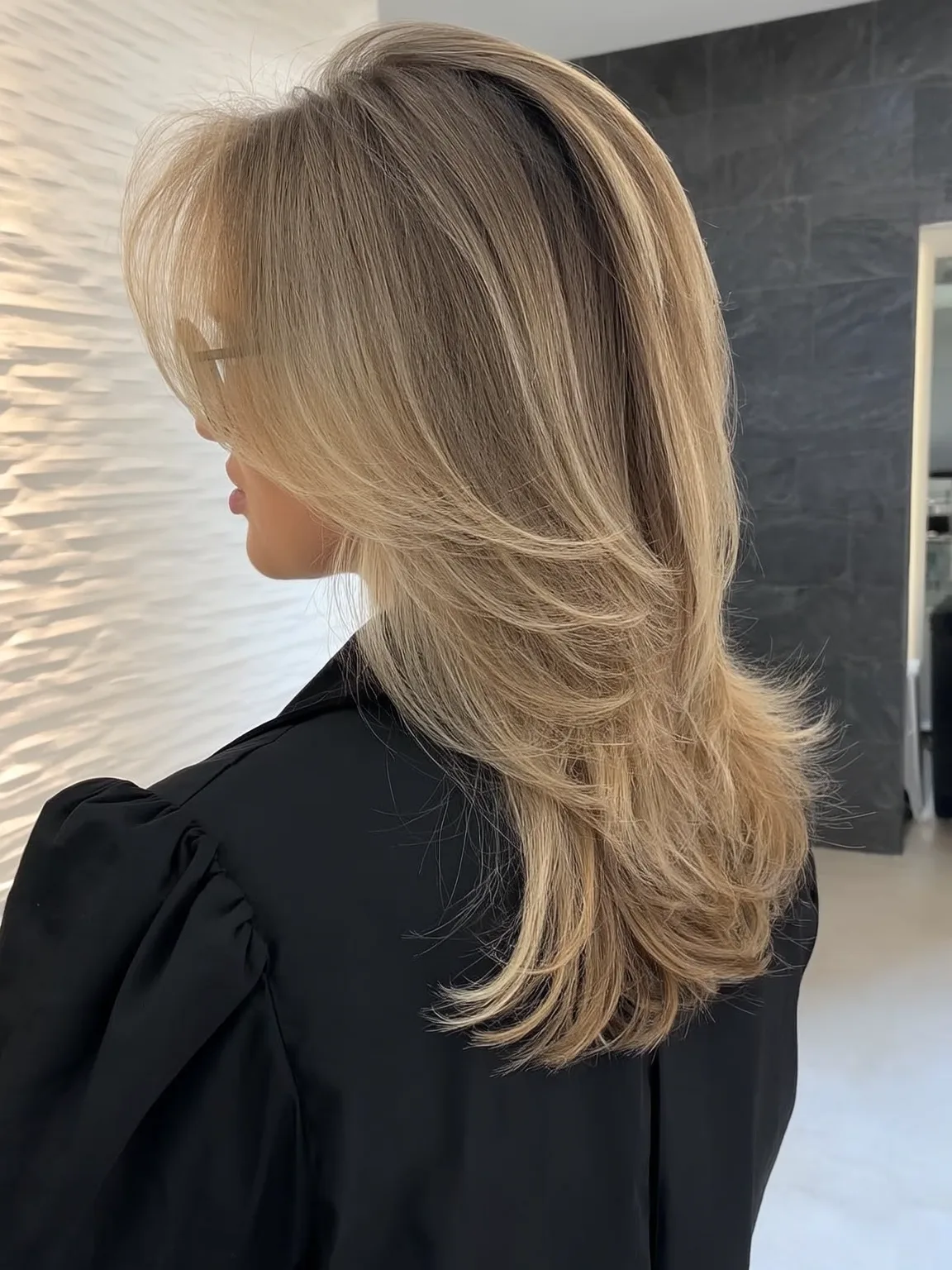 Soft Sandy Blonde Layered Cut with Curtain Bangs